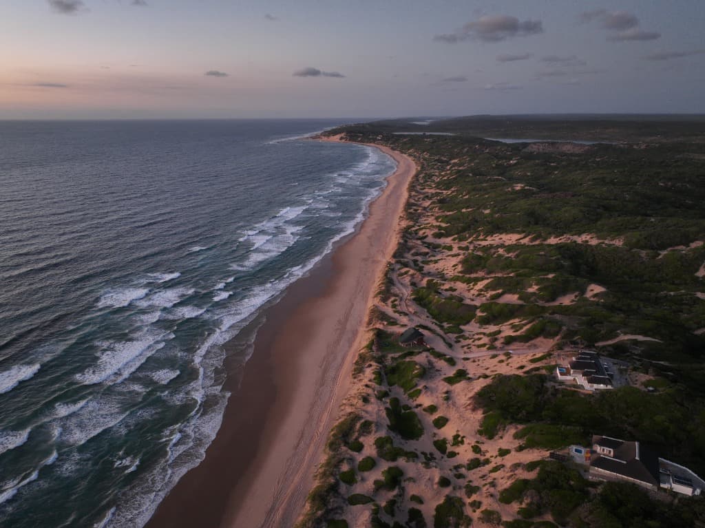Aerial view of the villa and pristine coastline